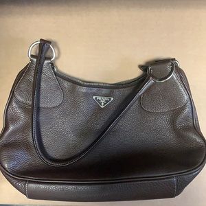 Chocolate brown Prada shoulder bag.
